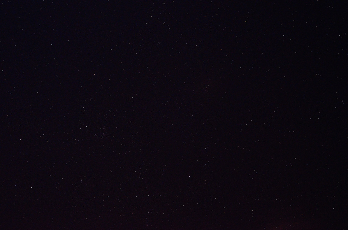 a night sky with a few stars in it