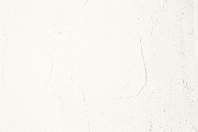 A white wall with a black and white clock on it